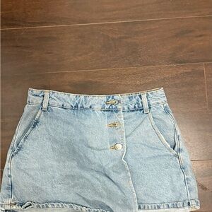 Zara Light Blue Jean Skort with a rip but that is stitched shut.